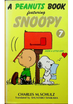 A peanuts book featuring Snoopy tom 7
